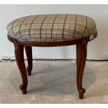 An upholstered oval mahogany stool, 55 x 40 x 46cm.