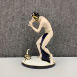 A Royal Dux porcelain figure of a snake charmer, H. 24cm.