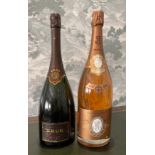 A 1.5 litre bottle of Krug champagne with a 1.5 litre bottle of Louis and Redderer crystal rose