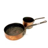 An 18th century copper and steel cooking pan, Dia. 26cm, together with a further copper saucepan.