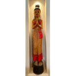 A painted carved wooden Thai figure (A/F), H. 128cm.