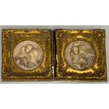 A pair of gilt framed reconstituted marble panels, 29 x 29cm.