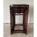 A nest of four oriental style hardwood tables, largest 39 x 38 x 72cm. Condition: slight sun