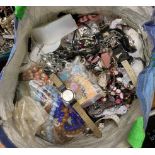 A large bag of mixed costume jewellery.