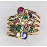 A 18ct yellow gold harlequin ring set with beautiful Sapphire, Ruby, Emerald and Diamond