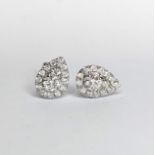 A set of 9ct white gold pear shape round brilliant cut diamonds earrings to a approx. total size