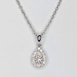 A 9ct white gold pear shape style round diamond set cluster pendant. this consist of 2 diamonds