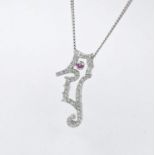 A 9ct white gold seahorse diamond set pendant with rubover set ruby. the pendant is on a 16 inch