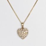 A 18ct yellow gold round brilliant cut diamond claw set heart shapped pendant on an 18 inch curb