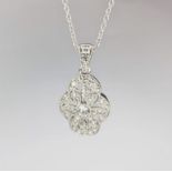 An 18ct white gold Art Deco diamond set pendant set with round brilliant cut diamonds there is 32