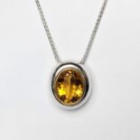 A 18ct white gold oval citren necklace with yellow gold rubover. the necklace consists of a large