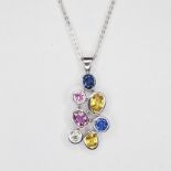 A 18ct white gold rubover bubble style sapphire and diamond set pendant consisting of 2 blue, 2 pink