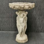 A vintage cast concrete birdbath, H. 81cm.