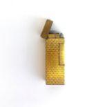 A Dunhill gold plated lighter, H. 6cm.