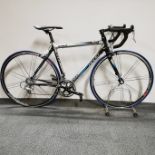 A BH FSA, OS 170 alloy Liberty Seguros road bicycle and stand with Veloce Campagnolo 10 speed breaks