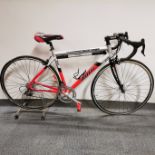 A 7005 T6 Lite series Massi Master compact road bicycle and stand with Ambrosio Balance rims and