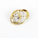 A 9ct yellow and white gold sapphire and diamond set brooch, L. 3cm, approx. 3.5gr.