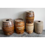 A group of four stoneware barrels, largest H. 40cm, together with an oak barrel.