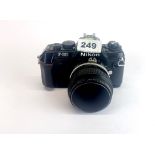 A Nikon F-301 single lens reflex camera with 55mm macro lens.