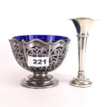 A hallmarked silver bud vase with a hallmarked silver and blue glass lined sugar bowl.