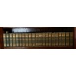 Twenty one clothbound volumes of the authentic edition of the works of Charles Dickens published
