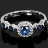 A 925 silver ring set with round cut sapphires, (N).