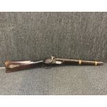 An 18th century percussion Enfield shotgun, L. 84cm.
