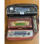 Three vintage Robert's portable radios and a car radio.