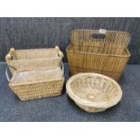 A vintage cane magazine rack, 39 x 31 x 32cm, together with three baskets.