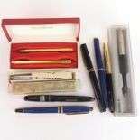 A group of mixed fountain pens etc.