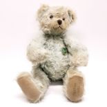 A 1997 Hermann articulated teddy bear with growler, L. 42cm.