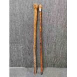 A Japanese carved bamboo walking stick, together with a natural form walking stick.
