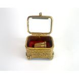 A Victorian yellow metal thimble with fitted case.