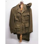 A vintage army uniform with belt and cap.