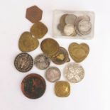 A quantity of silver and other coins and tokens.