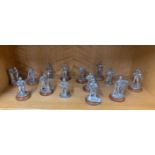 A quantity of pewter figures of Victorian street vendors.