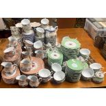 A large quantity of catering tea china with cake stands.