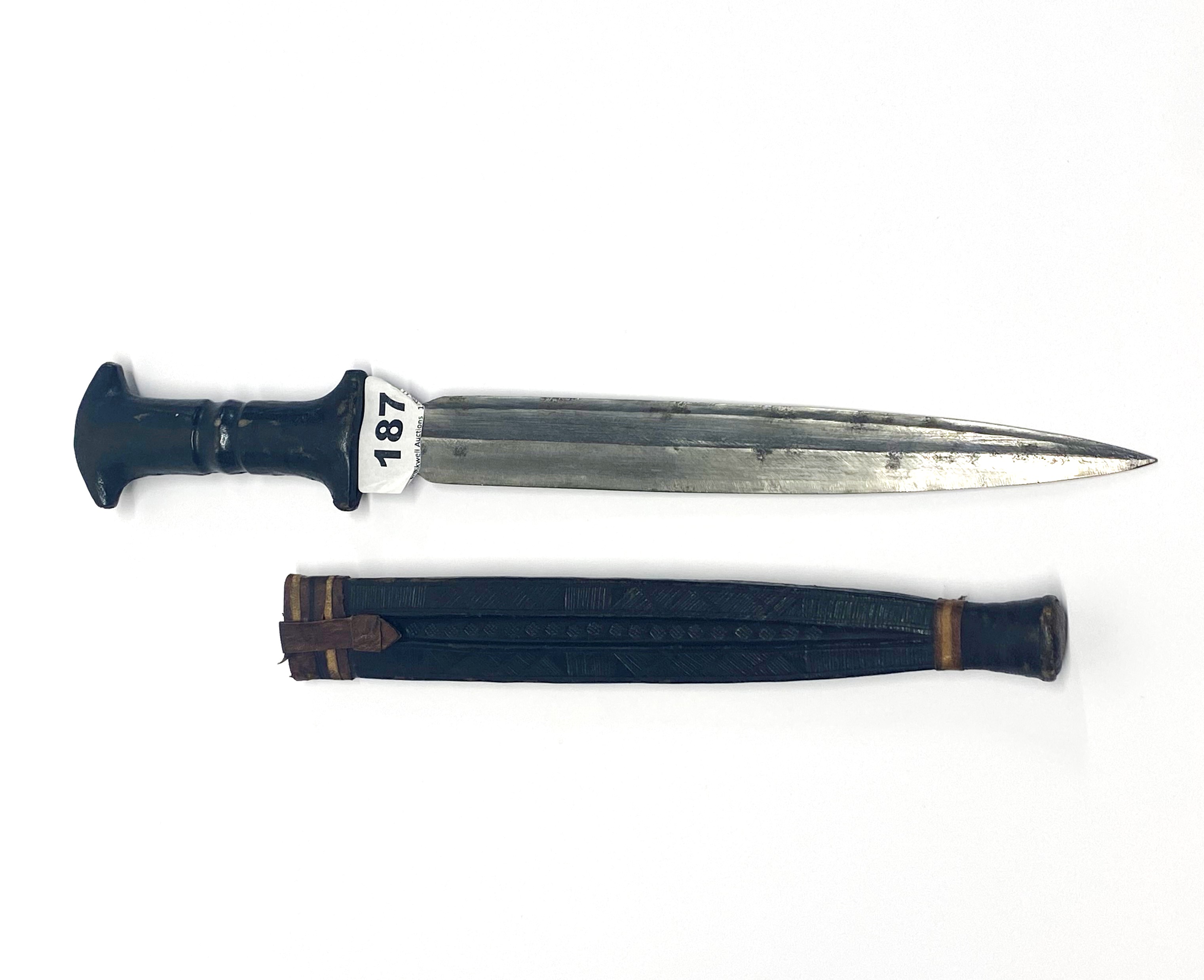An early Ethnic dagger in a leather sheath, L. 45cm. - Image 2 of 2