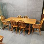 A solid oak dining table together with a set of six 'Webber Furniture' dining chairs, table 182 x 75