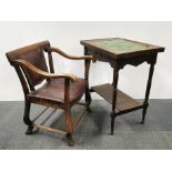 Aan Arts and Crafts upholstered oak armchair together with a tile topped two tier oak side table,