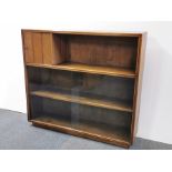 An oak bookshelf with sliding glass doors and small compartment, 109 x 98 x 25cm.