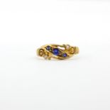 An antique Edwardian hallmarked 18ct yellow gold ring set with round cut tourmalines and
