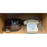 Two vintage telephones.