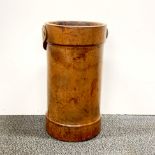 An antique leather umbrella stand with handle, Dia. 22cm, H. 41cm.