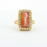 An antique continental 18ct yellow gold Cameo set ring surrounded by rose cut diamonds, (T).