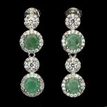 A pair of 925 silver drop earrings set with round cut emeralds and white stones, L. 2.6cm.