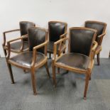 A set of six leather upholstered carver dining chairs, H. 82cm.