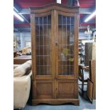 An early 20th century oak cabinet with wooden shelves, 193 x 90 x 33cm.