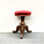 A Victorian mahogany piano stool.