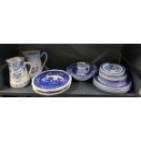 A quantity of mixed blue and white china.